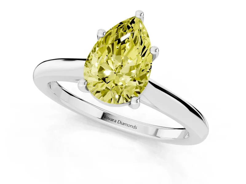 Fancy Yellow Pear Cut Diamond Solitaire Ring Set in Platinum with Cathedral Band and Prong Setting