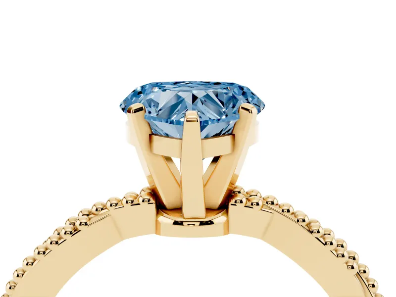 Fancy Blue Heart Cut Diamond Solitaire Ring Set in Yellow gold with Twisted Band and Bead Prong Setting