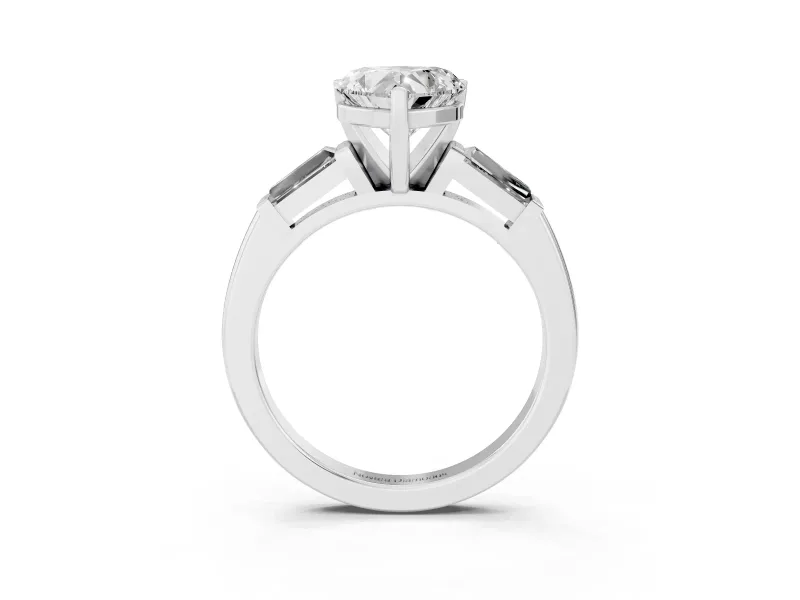 Heart Cut Diamond Solitaire Ring Set in White gold with Tapered Baguette Side Stones and Prong Setting