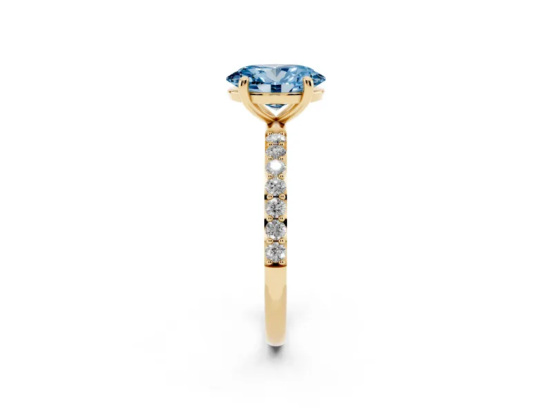 Fancy Blue Oval Cut Diamond Solitaire Ring Set in Yellow gold with Round Pavé Band and Prong Setting