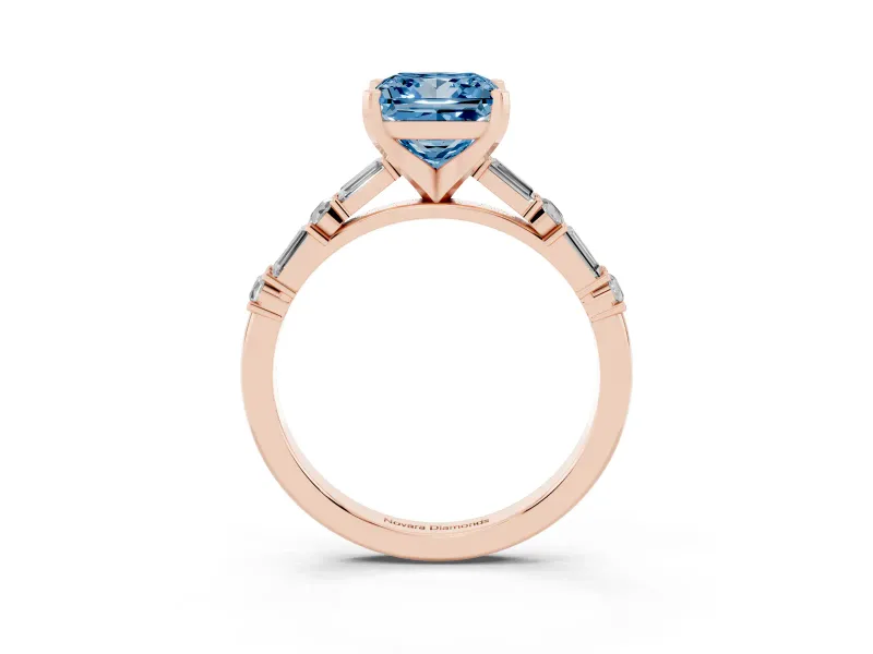 Fancy Blue Princess Cut Diamond Solitaire Set in Rose gold with Side Baguettes and Channel Set Band