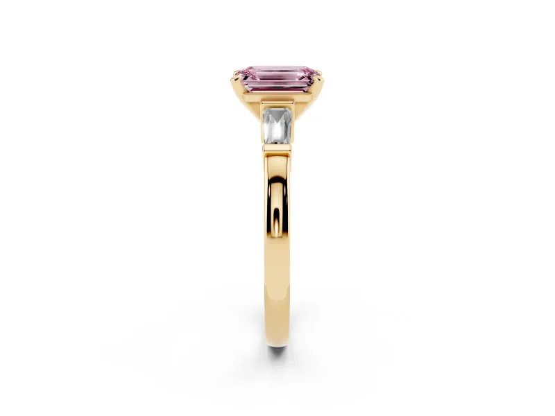 Fancy Pink Emerald Cut Diamond Solitaire Ring Set in Yellow gold with Tapered Baguette Accents and Prong Setting