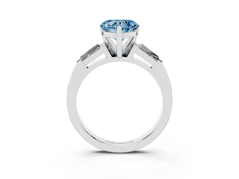 Fancy Blue Heart Cut Diamond Solitaire Ring Set in White gold with Tapered Baguette Side Stones and Prong Setting