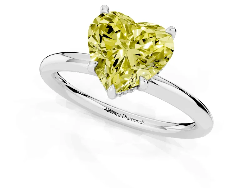 Fancy Yellow Heart Cut Diamond Solitaire Ring Set in Silver with Thin Band and Prong Setting