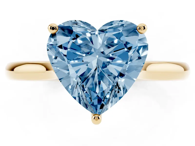 Fancy Blue Heart Cut Diamond Solitaire Ring Set in Yellow gold with Cathedral Band and Prong Setting