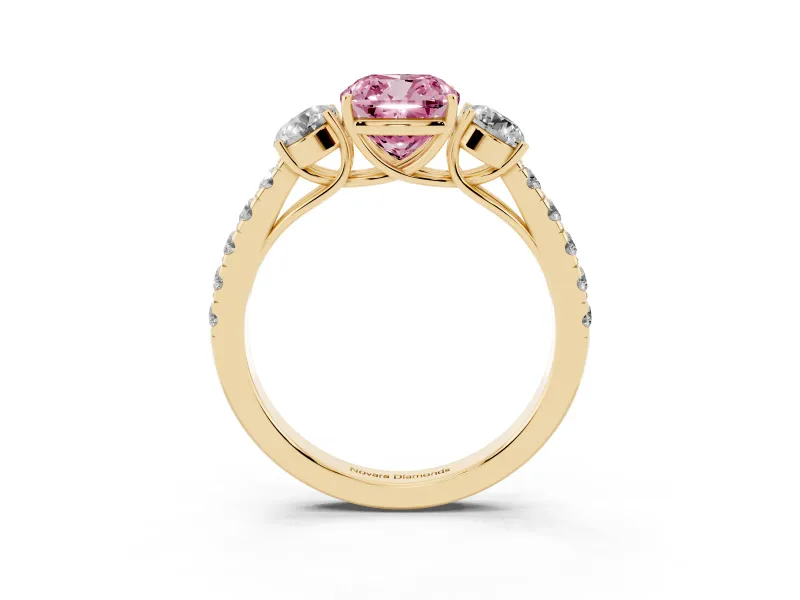 Fancy Pink Cushion Cut Diamond Three-Stone Ring Set in Yellow gold with Round Side Stones and Delicate Pavé Band