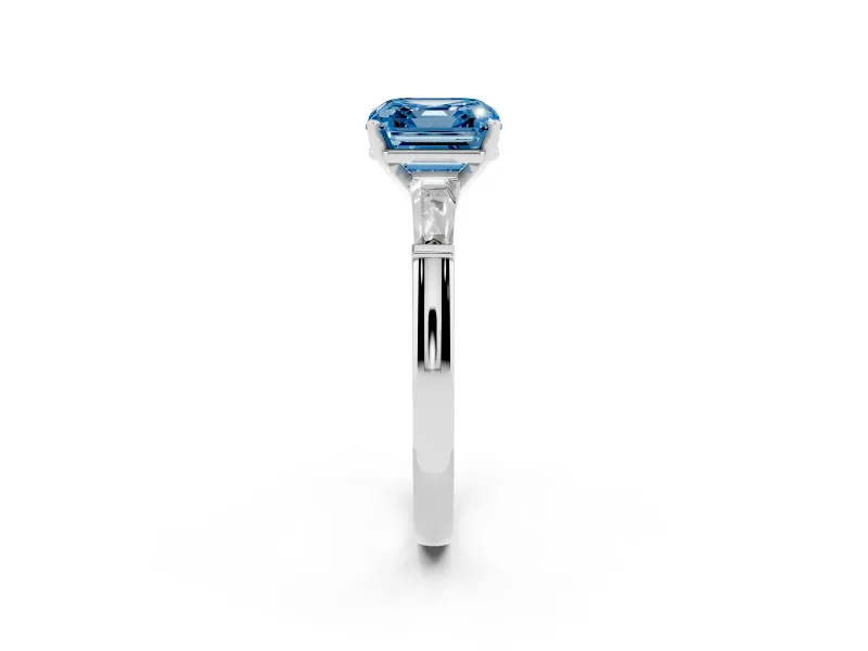 Fancy Blue Asscher Cut Diamond Solitaire Ring Set in White gold with Tapered Baguette Side Stones and Prong Setting
