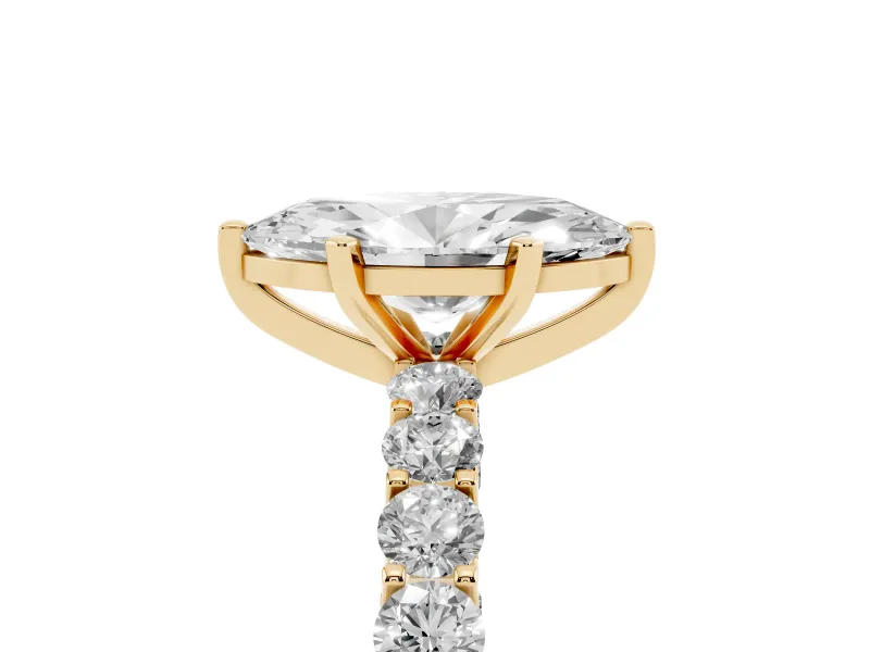 Marquise Cut Diamond Solitaire Ring Set in Yellow gold with Shared Prong Pavé Band