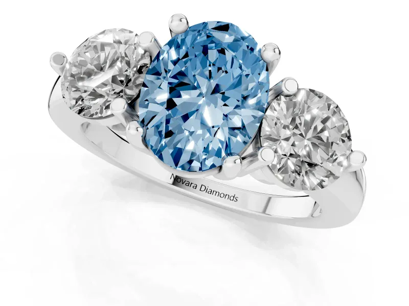 Fancy Blue Oval Cut Diamond Three-Stone Ring Set in Silver with Prong Setting and Classic Band