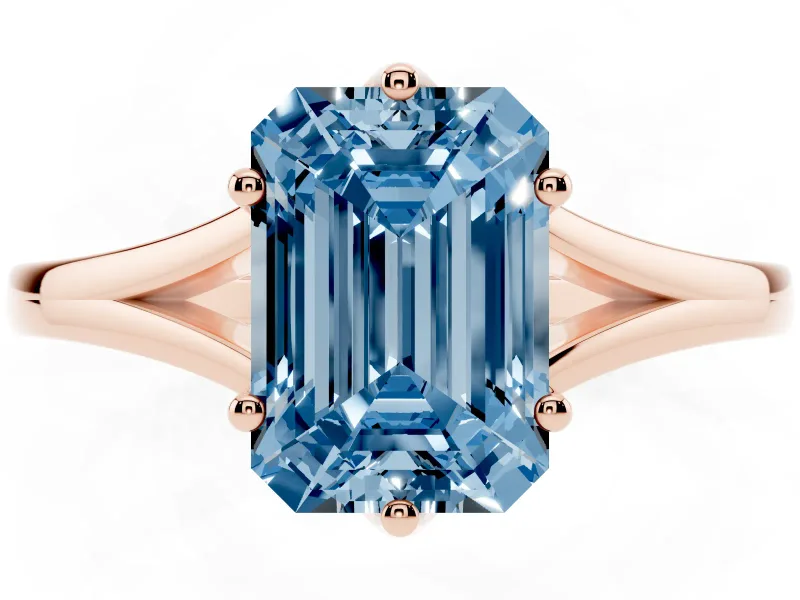 Fancy Blue Emerald Cut Diamond Solitaire Ring Set in Rose gold with Polished Tapered Band and Prong Setting