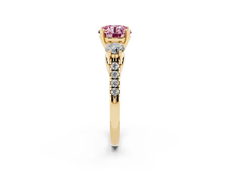 Fancy Pink Three-Stone Round Cut Diamond Pavé Band Ring Set in Yellow gold with Prong-Set Trio