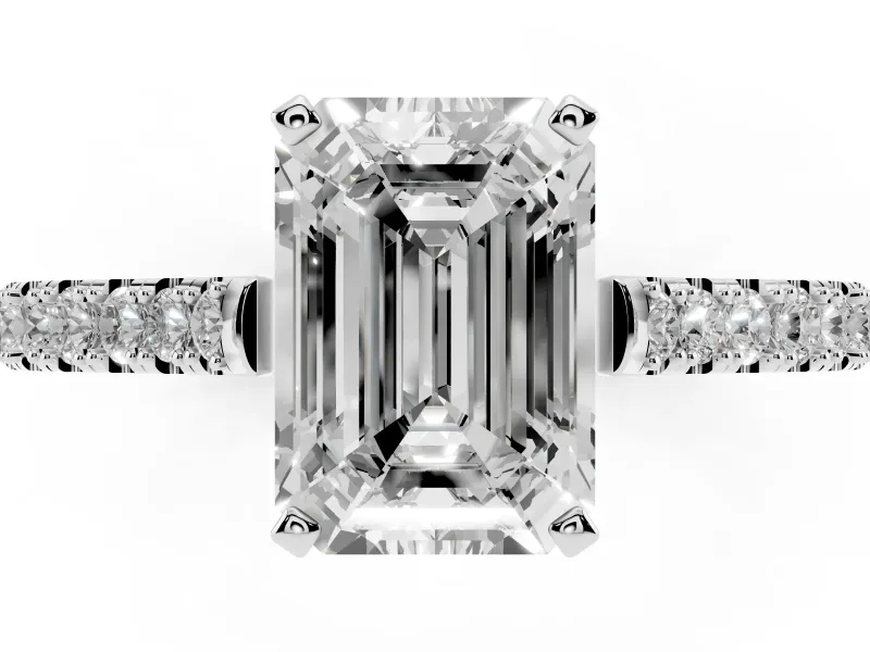 Emerald Cut Diamond Solitaire Engagement Ring Set in White gold with Delicate Pavé Band and Prong Setting