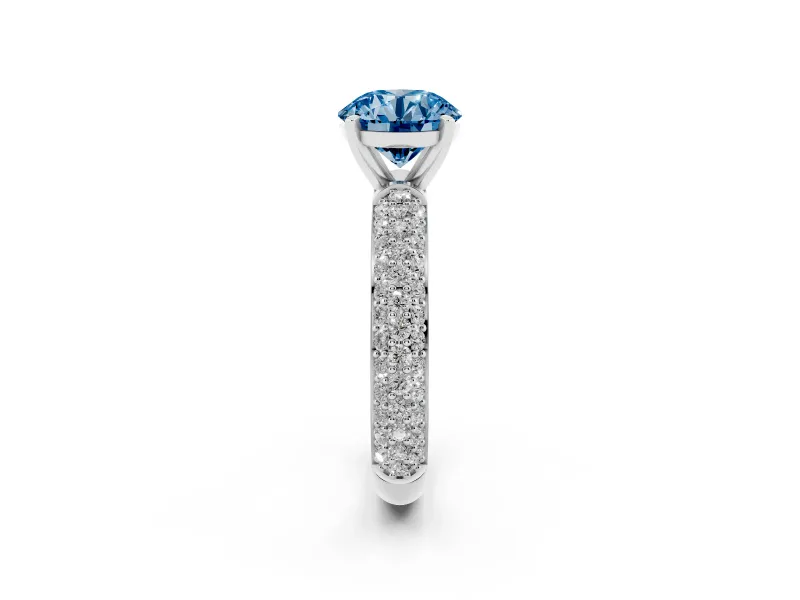 Fancy Blue Round Cut Diamond Solitaire Ring Set in Platinum with Prong Setting and Pavé-Set Band