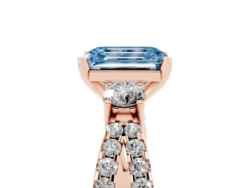 Fancy Blue Emerald Cut Diamond Three-Stone Ring Set in Rose gold with Pavé Split Shank and Prong Setting
