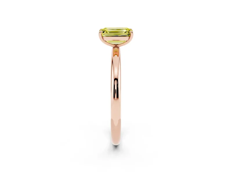 Fancy Yellow Emerald Cut Diamond Solitaire Ring Set in Rose gold with Prong Setting on a Polished Plain Band