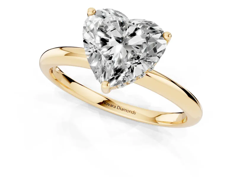 Heart Cut Diamond Solitaire Engagement Ring Set in Yellow gold with Prong Setting and Polished Band