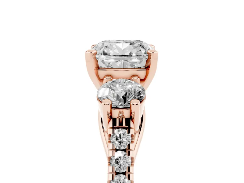 Three-Stone Cushion Cut Diamond Pavé Band Ring Set in Rose gold with Prong-Set Trio