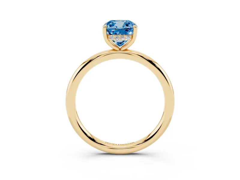 Fancy Blue Cushion Cut Diamond Solitaire Ring Set in Yellow gold with Thin Band and Prong Setting
