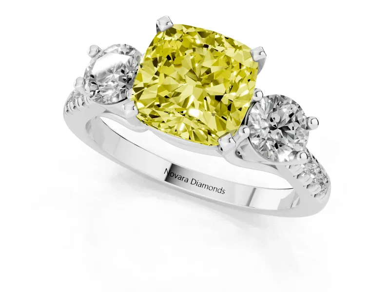 Fancy Yellow Three-Stone Cushion Cut Diamond Pavé Band Ring Set in White gold with Prong-Set Trio
