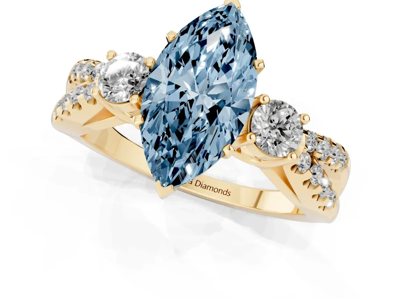 Fancy Blue Marquise Cut Diamond Three-Stone Ring Set in Yellow gold with Pavé Split Shank and Prong Setting