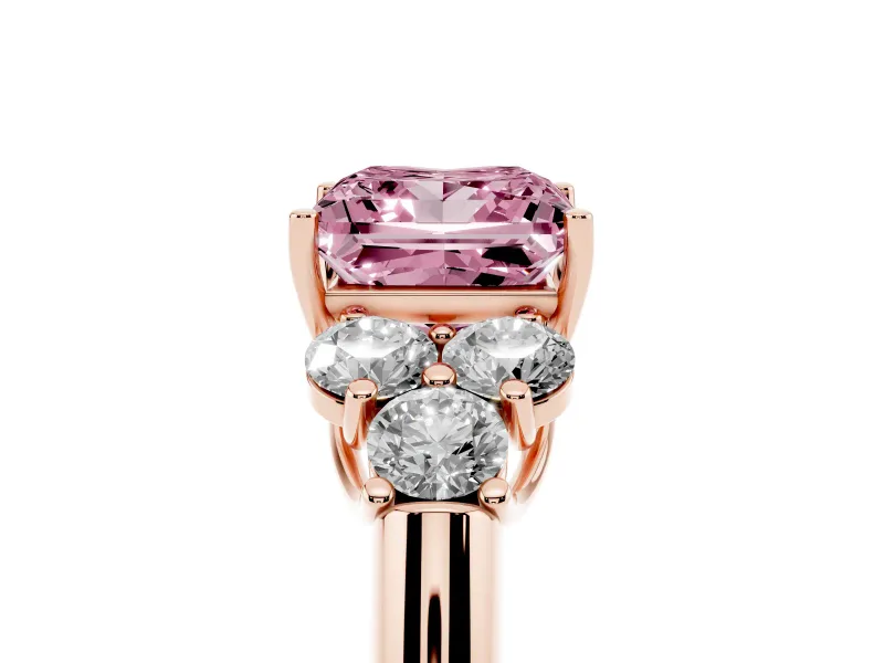 Fancy Pink Princess Cut Diamond Cluster Ring Set in Rose gold with Round Accent Stones and Prong Setting on a Plain Band