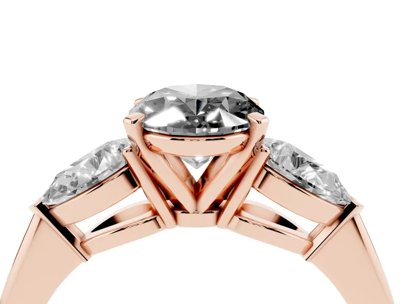 Fancy Black Three-Stone Oval Cut Diamond Ring Set in Rose gold with Pear Side Stones and Prong Setting