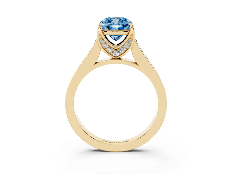 Fancy Blue Cushion Cut Diamond Solitaire Pavé Engagement Ring Set in Yellow gold with Prong Setting