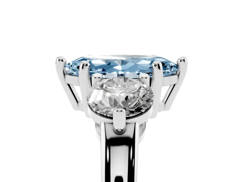 Fancy Blue Marquise Cut Diamond Three-Stone Ring Set in Platinum with Prong Setting and Classic Band