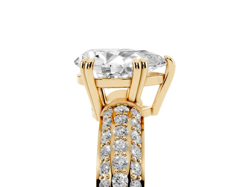 Pear Cut Diamond Solitaire Ring Set in Yellow gold with Multi-Row Round Pavé Band and Prong Setting