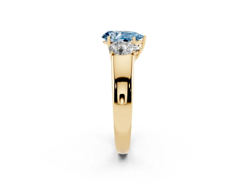 Fancy Blue Three-Stone Pear Cut Diamond Ring Set in Yellow gold with Matching Prong Settings and Plain Band