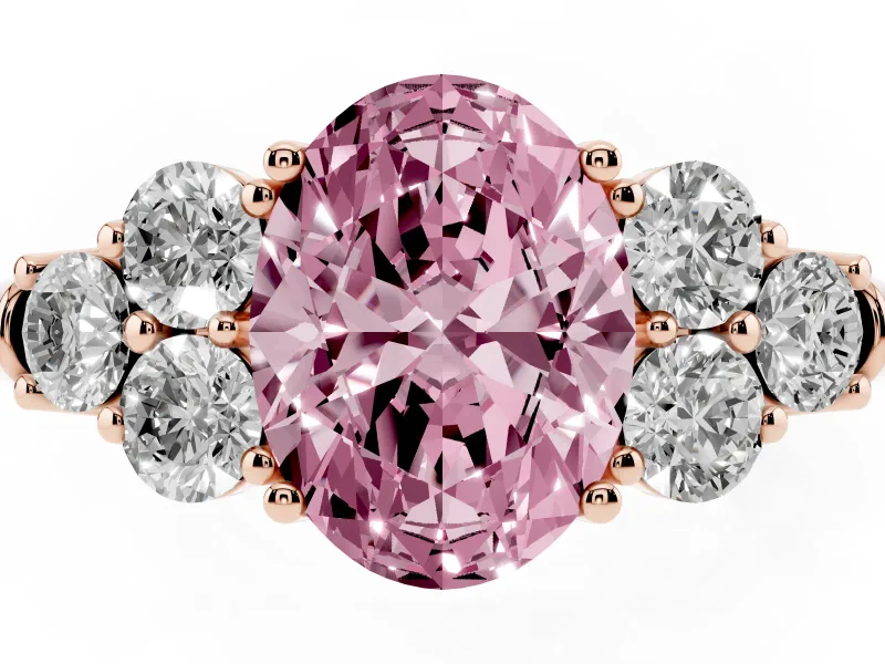 Fancy Pink Oval Cut Diamond Cluster Ring Set in Rose gold with Round Accent Stones and Prong Setting on a Plain Band
