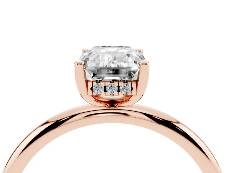 Emerald Cut Diamond Solitaire Engagement Ring Set in Rose gold with Prong Setting and Polished Band