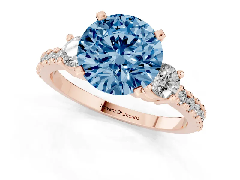 Fancy Blue Three-Stone Round Cut Diamond Pavé Band Ring Set in Rose gold with Prong Setting
