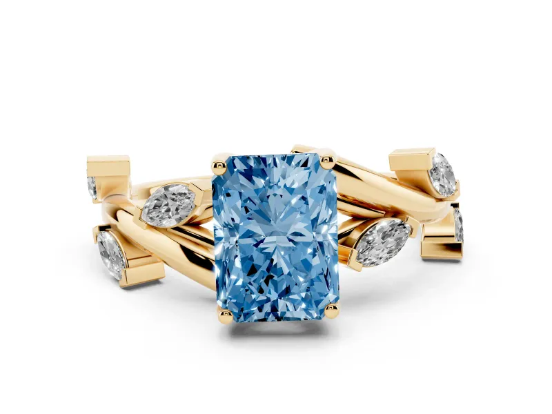 Fancy Blue Radiant Cut Diamond Solitaire Ring Set in Yellow gold with Twisted Marquise Accent Band