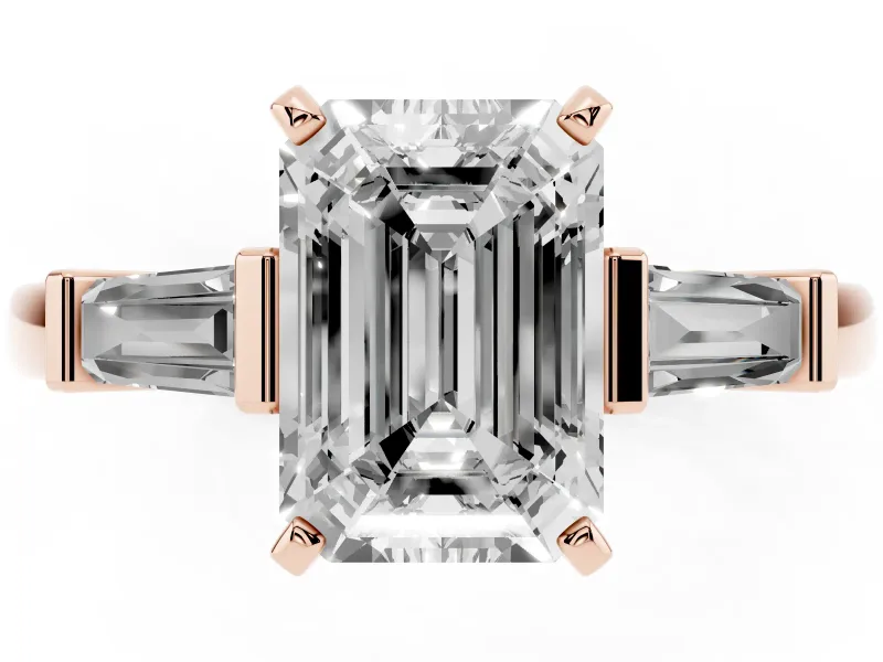 Emerald Cut Diamond Solitaire Ring Set in Rose gold with Tapered Baguette Accents and Prong Setting