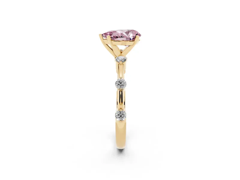 Fancy Pink Pear Cut Diamond Solitaire Ring Set in Yellow gold with Bezel Set Side Stones and Prong Setting