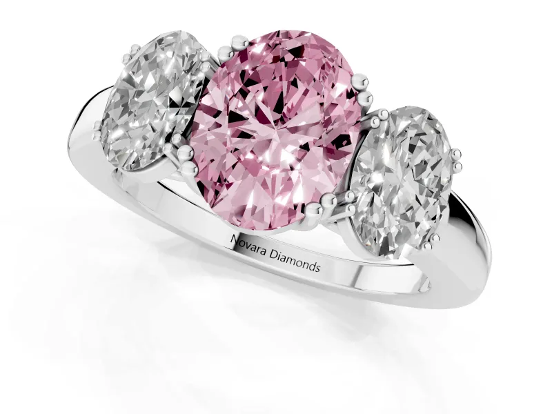 Fancy Pink Oval Cut Diamond Three-Stone Ring Set in Platinum with Polished Band and Prong Setting