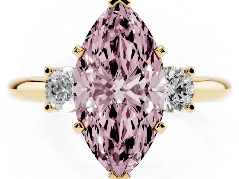 Fancy Pink Three-Stone Marquise Cut Diamond Ring Set in Yellow gold with Prong Setting and Plain Band