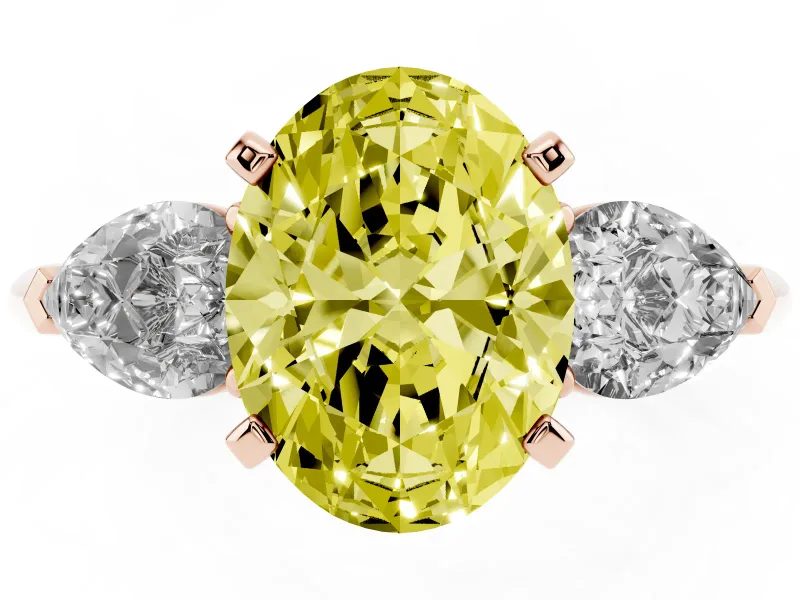 Fancy Yellow Three-Stone Oval Cut Diamond Ring Set in Rose gold with Pear Side Stones and Prong Setting