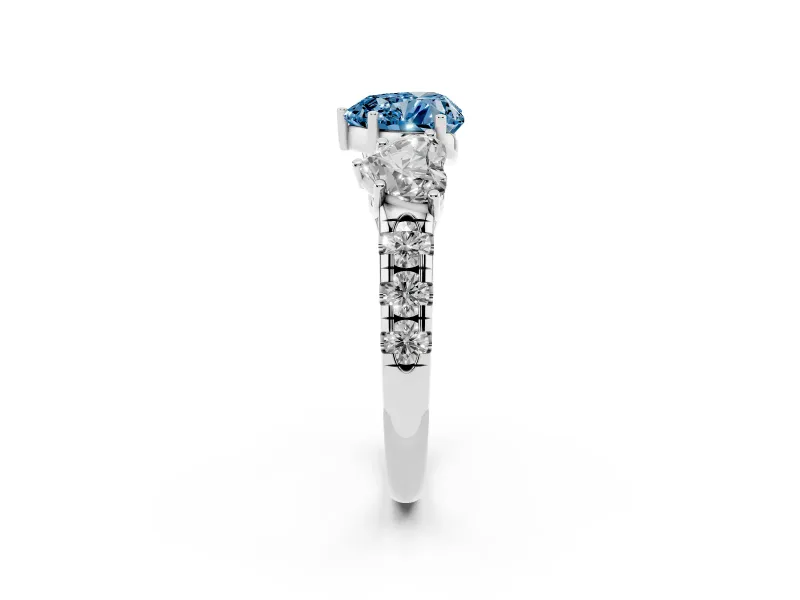 Fancy Blue Heart Cut Diamond Three-Stone Ring Set in Platinum with Pavé Band