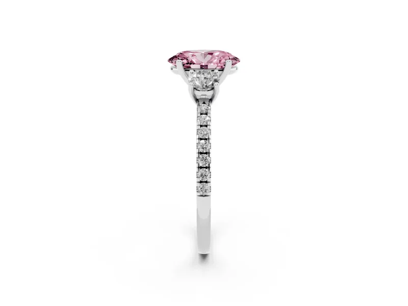 Fancy Pink Oval Cut Diamond Three-Stone Ring Set in White gold with Pavé Band and Graduated Sides