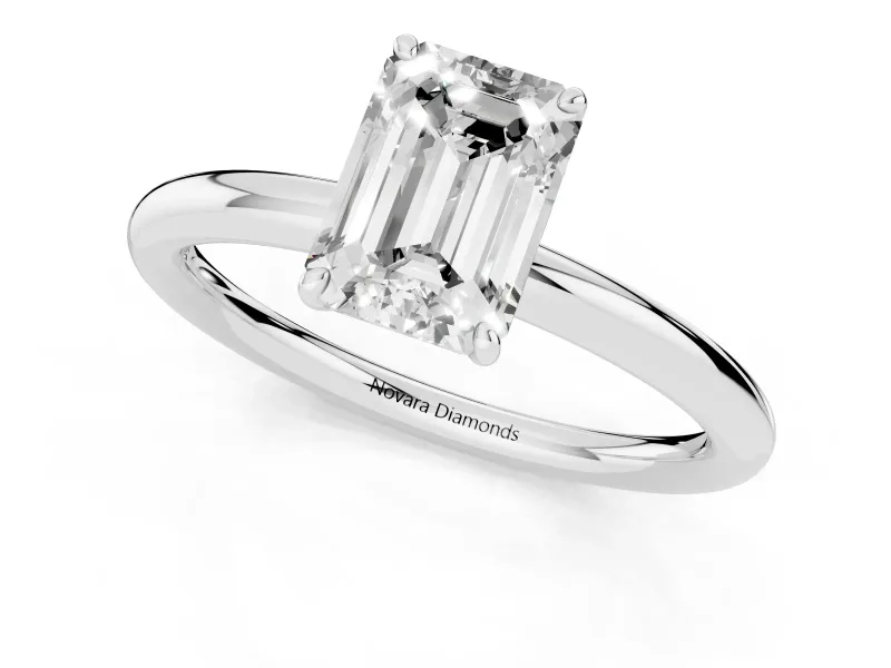 Emerald Cut Diamond Solitaire Ring Set in White gold with Prong Setting on a Polished Plain Band