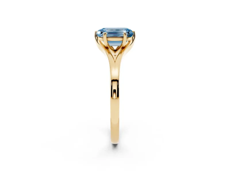 Fancy Blue Emerald Cut Diamond Solitaire Ring Set in Yellow gold with Polished Tapered Band and Prong Setting