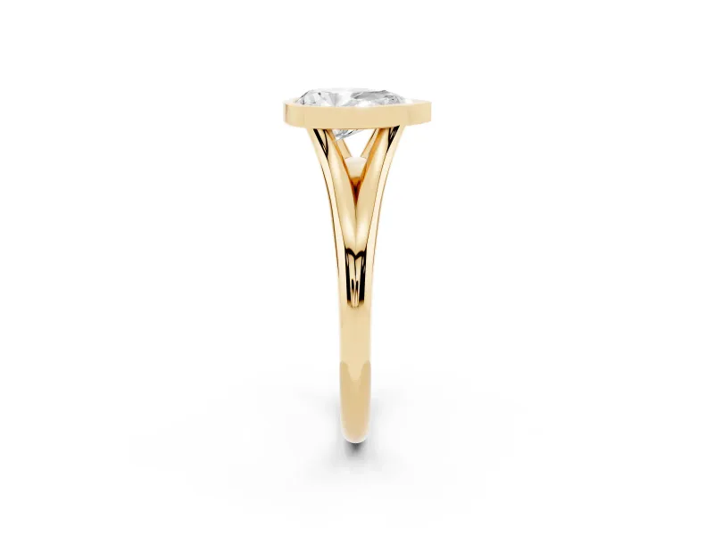 Bezel Set Pear Cut Diamond Solitaire Ring Set in Yellow gold with Tapered Band