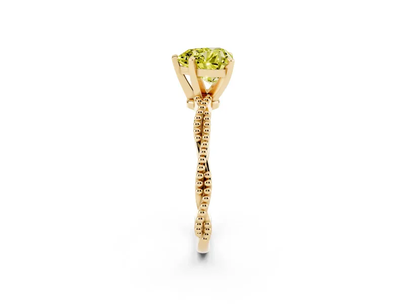 Fancy Yellow Heart Cut Diamond Solitaire Ring Set in Yellow gold with Twisted Band and Bead Prong Setting