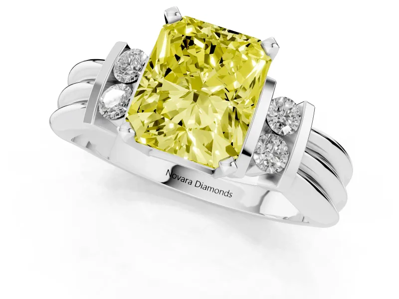 Fancy Yellow Three-Stone Radiant Cut Diamond Channel Set Ring Set in White gold with Bar Prongs