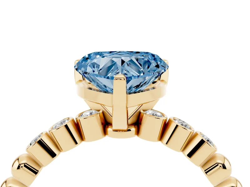 Fancy Blue Heart Cut Diamond Solitaire Engagement Ring Set in Yellow gold with Bezel Accents on Beaded Band