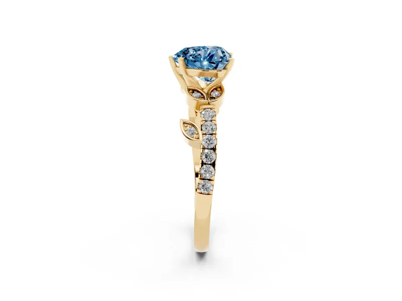 Fancy Blue Heart Cut Diamond Solitaire Leaf-Inspired Ring Set in Yellow gold with Pavé Band and Prong Setting