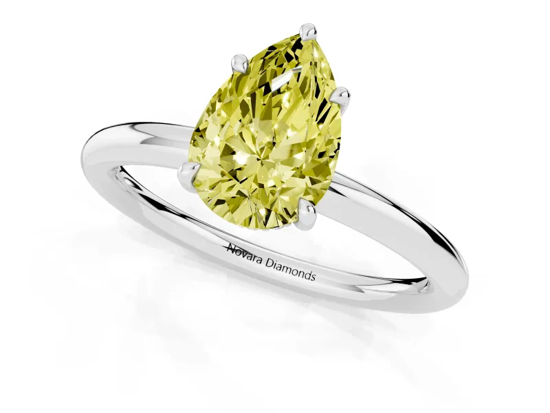 Fancy Yellow Pear Cut Diamond Solitaire Ring Set in Silver with Thin Band and Prong Setting