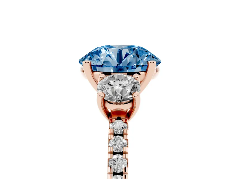 Fancy Blue Round Cut Diamond Three-Stone Ring Set in Rose gold with Pavé Band and Graduated Sides